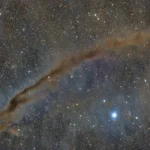 NASA’s Astronomy Picture of the Day Spotlights the Mysterious Dark Doodad Nebula, Revealing Stellar Nurseries and Cosmic Coincidences
